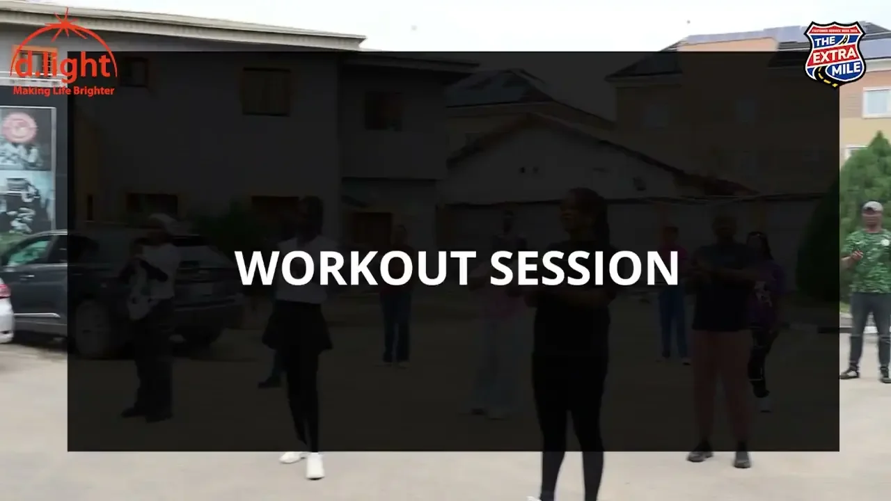 The workout session title appears over colleagues exercising in a courtyard; a frame from Taking care of ourselves.